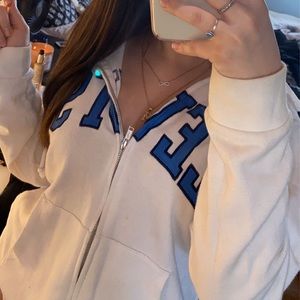 Levi’s zip up jacket, white with Blue logo